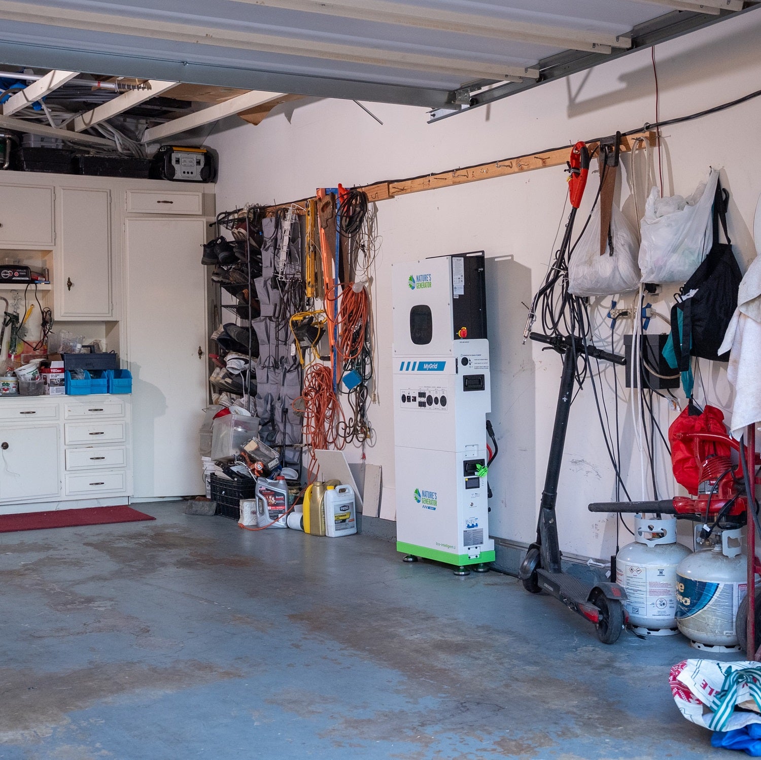 Scene 
Garage with tools, equipment, and a charging station.